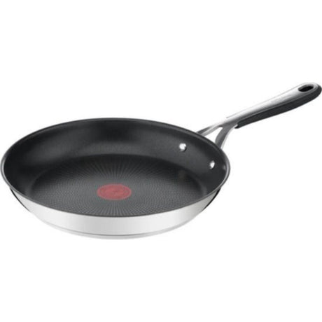 Tefal Jamie Oliver 5-delige RVS pannenset met wok en hapjespan op een inductiekookplaat