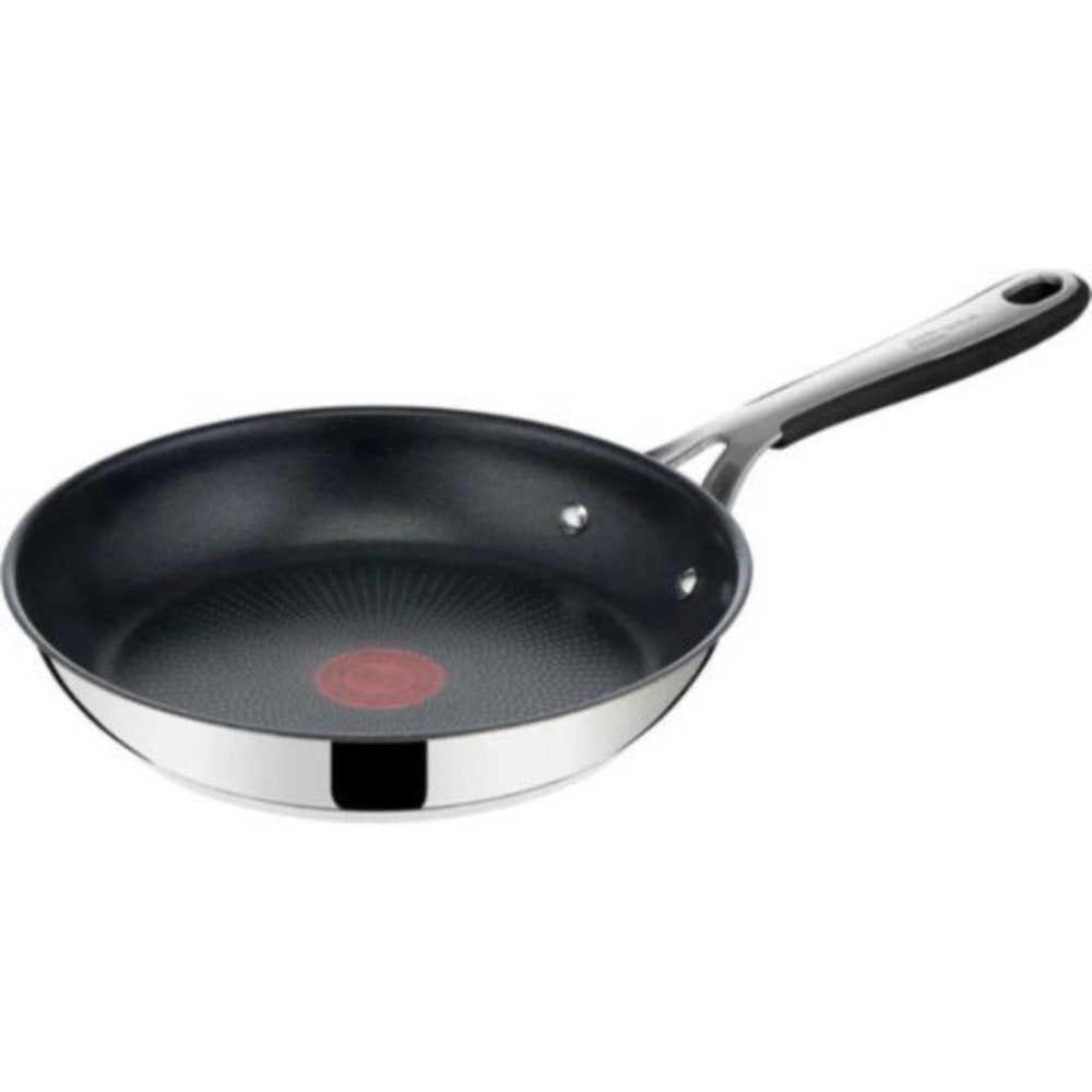 Tefal Jamie Oliver 5-delige RVS pannenset met wok en hapjespan op een inductiekookplaat
